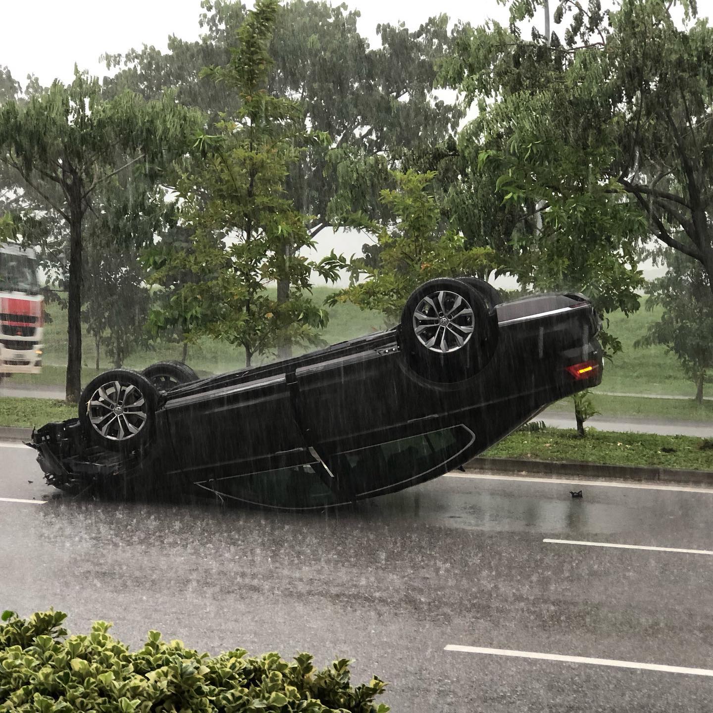 Car lipped over on a rainy day