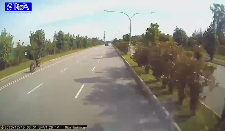 Loose tire almost cause an accident with a cyclist image