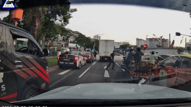 police break car window and arrest driver