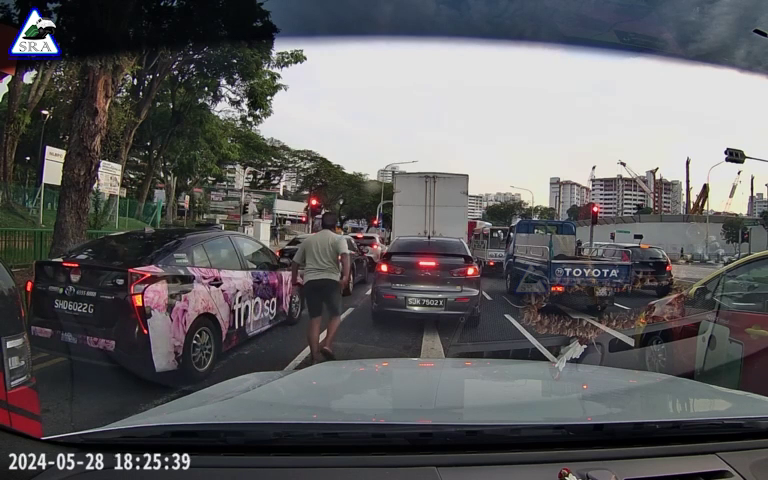 guy stoping car at Admiralty Rd