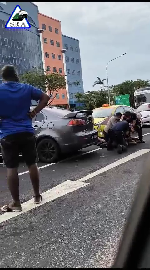 person pinned by Singapore police
